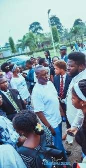 Students gathered around Niyi Adesanya at UNIBEN